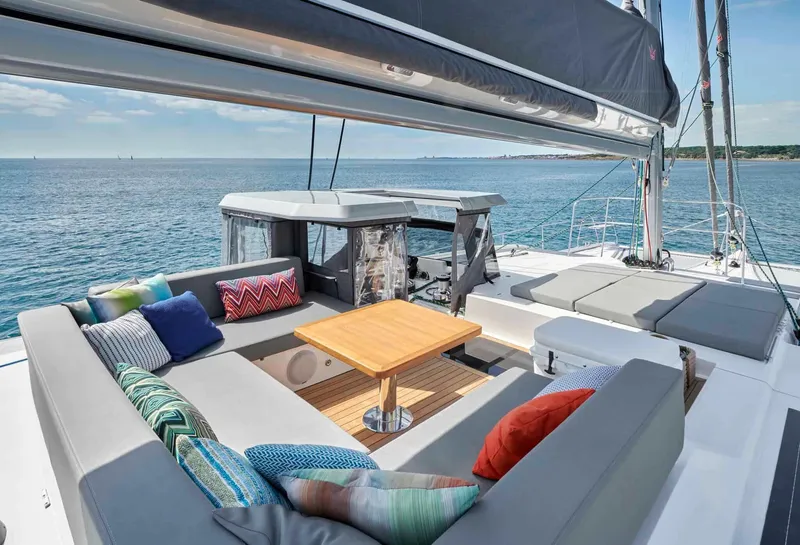 Slide: The Image of Luxury Privilege Signature 580 yacht deck with seating, colorful cushions, and ocean view, 2025 model. - 18