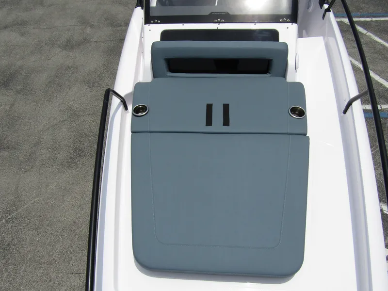 Slide: The Image of 2024 Axopar 25 Cross Top boat with cushioned seating area. - 11