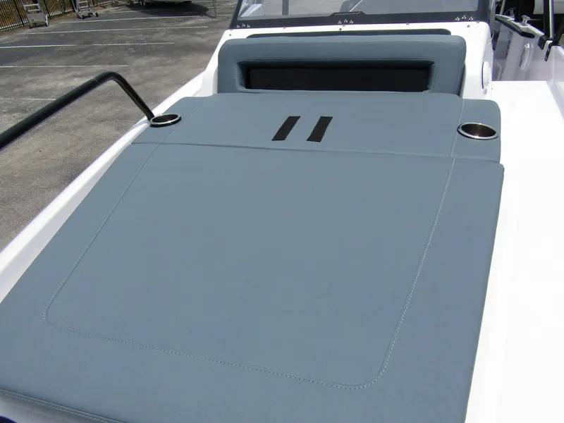 Slide: The Image of 2024 Axopar 25 Cross Top boat with cushioned seating and cup holders. - 12