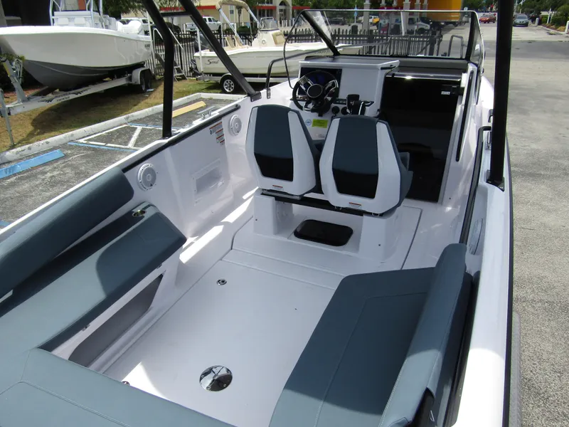 Slide: The Image of 2024 Axopar 25 Cross Top boat interior with dual seats and spacious layout. - 30
