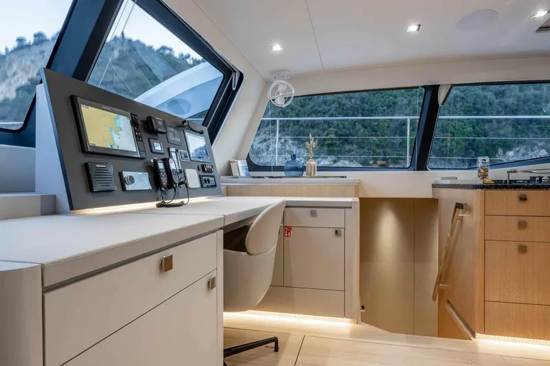 Slide: The Image of Luxurious interior of 2025 Privilege Signature 580 yacht with modern navigation station. - 42
