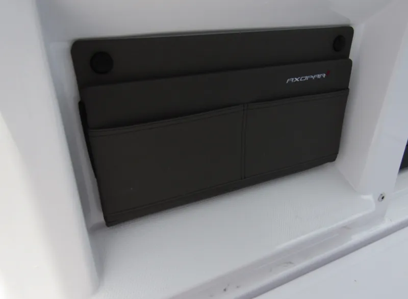 Slide: The Image of Storage compartment on the 2024 Axopar 25 Cross Top boat. - 18