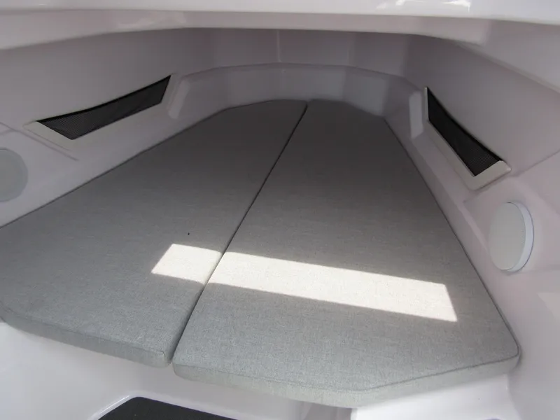 Slide: The Image of 2024 Axopar 25 Cross Top cabin interior with cushioned sleeping area. - 21