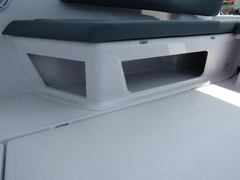 Slide: The Image of Storage compartment on the 2024 Axopar 25 Cross Top boat. - 26