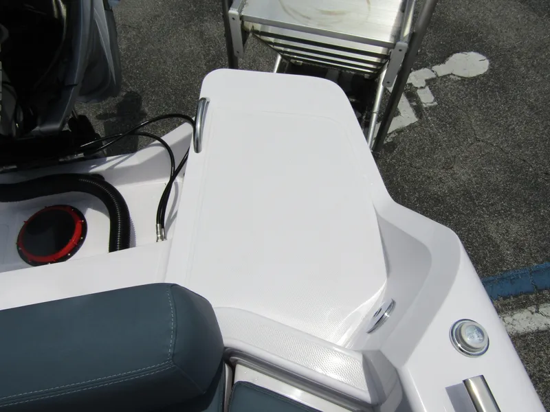 Slide: The Image of 2024 Axopar 25 Cross Top boat deck with seating and storage. - 29