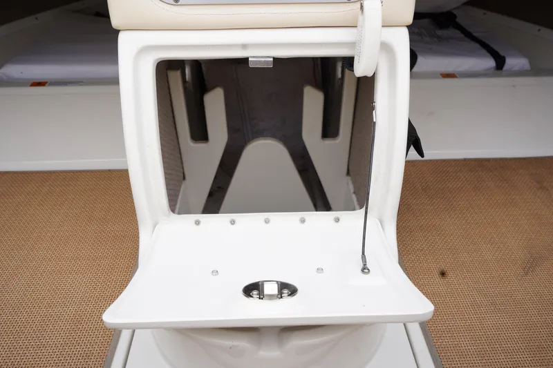 Slide: The Image of 2015 Chris-Craft Lancer 20 boat interior storage compartment with open hatch. - 17