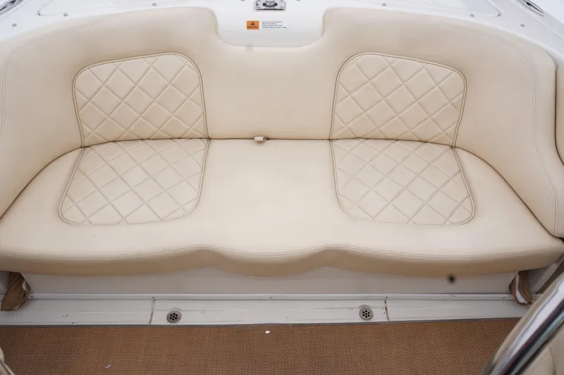 Slide: The Image of Cream leather seating on 2015 Chris-Craft Lancer 20 boat, featuring diamond stitching. - 19