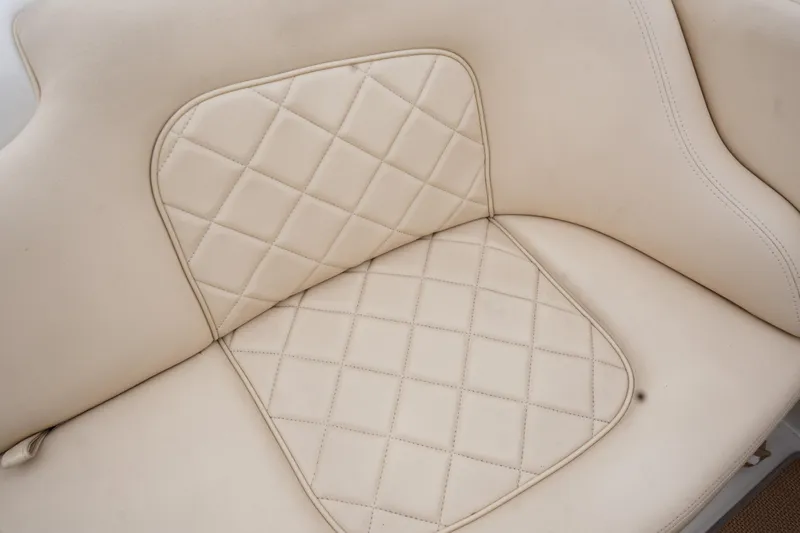 Slide: The Image of Cream leather seat with diamond stitching on a 2015 Chris-Craft Lancer 20 boat. - 20