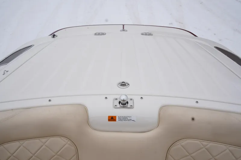 Slide: The Image of 2015 Chris-Craft Lancer 20 boat deck with beige quilted seating. - 27