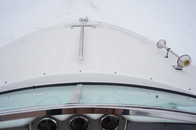 Slide: The Image of 2015 Chris-Craft Lancer 20 boat bow with chrome details and instruments. - 30