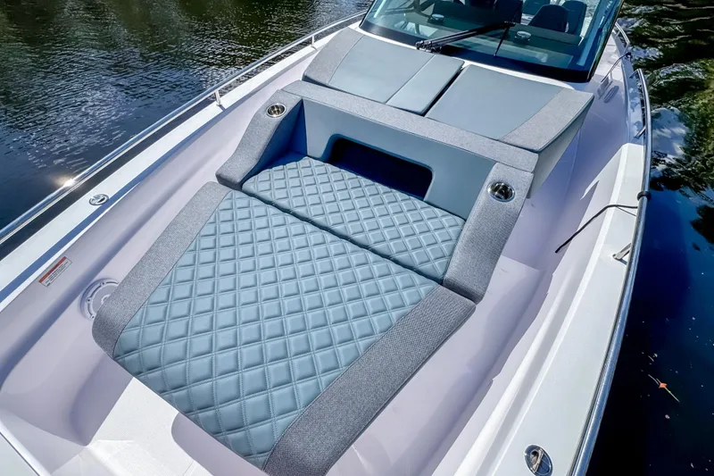 Slide: The Image of 2024 Axopar 37 Sun Top boat with luxurious quilted seating on deck. - 27