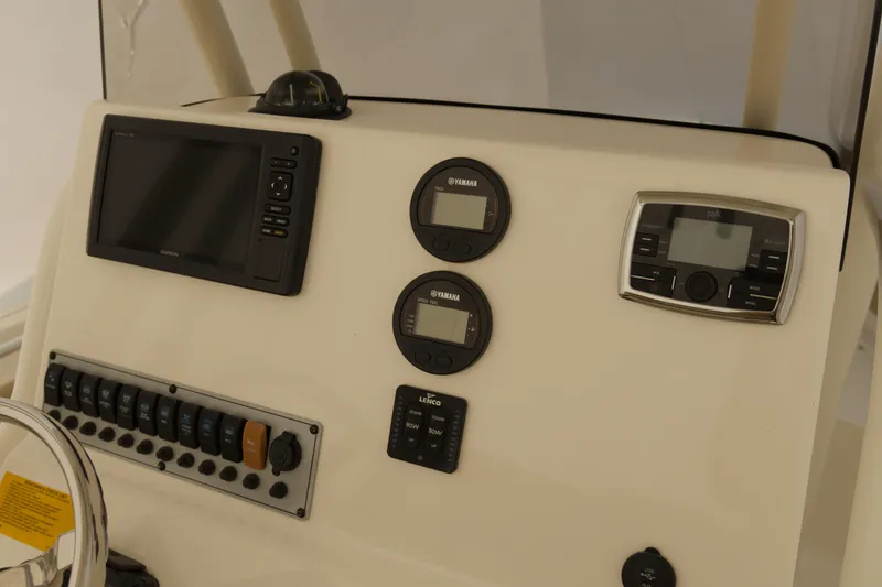 Slide: The Image of 2017 Key West 219 FS boat dashboard with Garmin display and Yamaha gauges. - 1