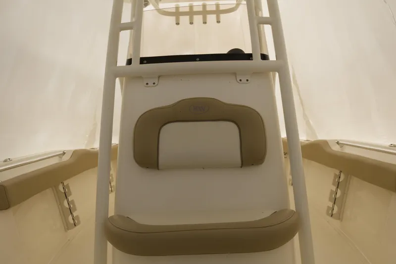 Slide: The Image of 2017 Key West 219 FS boat interior with beige seating and white framework. - 3