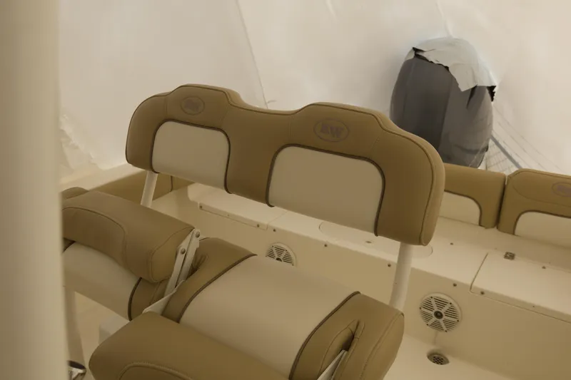 Slide: The Image of 2017 Key West 219 FS boat interior with beige seating and speaker. - 5