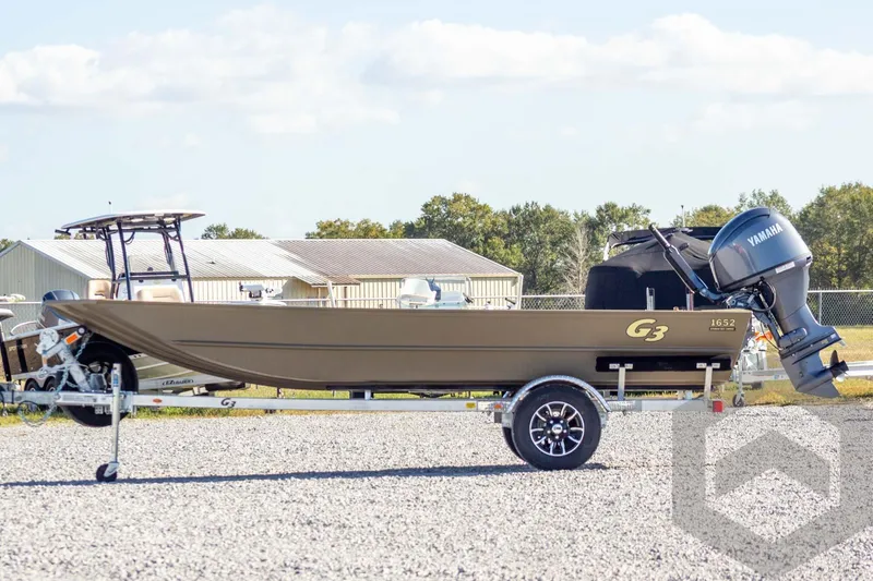Slide: The Image of 2026 G3 Gator Tough 1652 VBW boat on trailer with Yamaha outboard motor. - 11