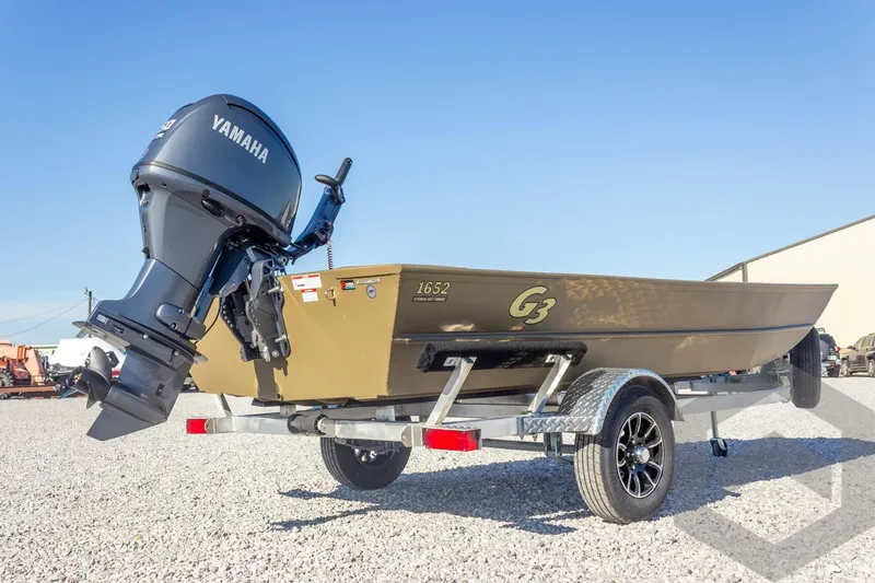 Slide: The Image of 2026 G3 Gator Tough 1652 VBW boat with Yamaha motor on a trailer. - 15