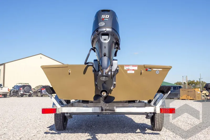 Slide: The Image of 2026 G3 Gator Tough 1652 VBW boat on trailer, rear view with motor. - 16