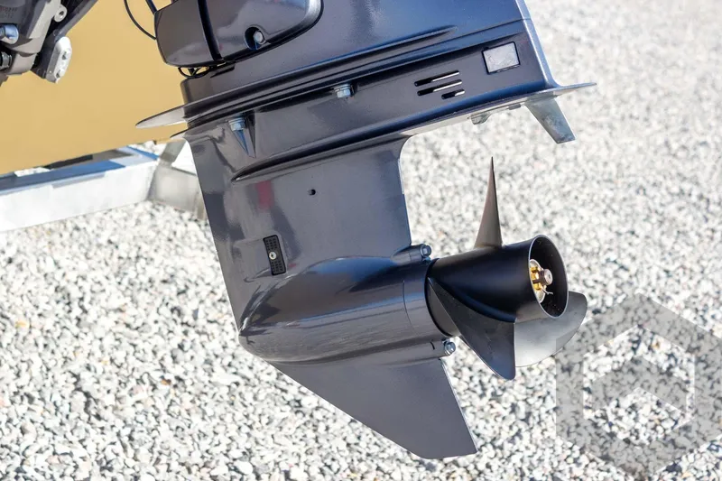 Slide: The Image of Outboard motor of 2026 G3 Gator Tough 1652 VBW on gravel surface. - 21