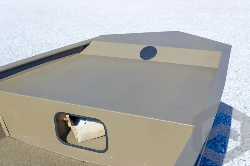 Slide: The Image of 2026 G3 Gator Tough 1652 VBW boat, close-up of storage compartment on deck. - 26