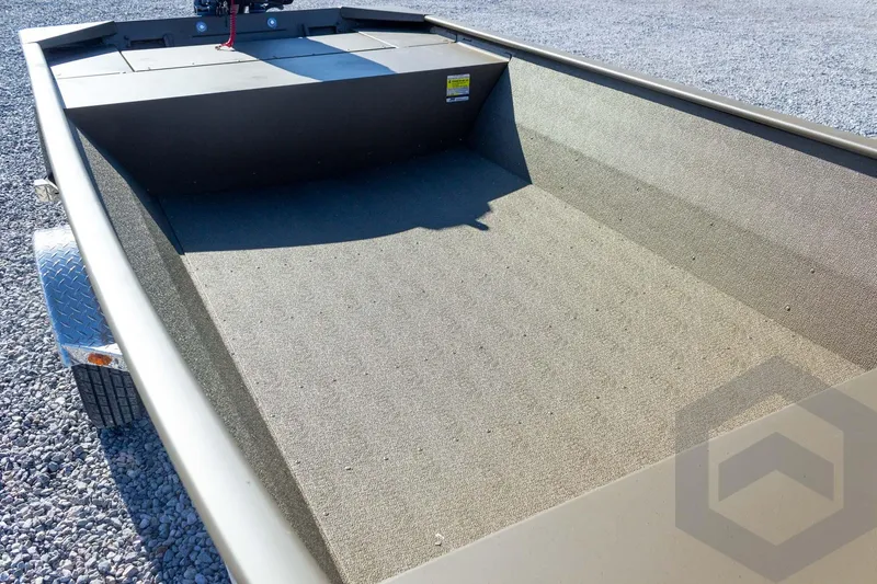 Slide: The Image of 2026 G3 Gator Tough 1652 VBW boat interior with carpeted flooring. - 29