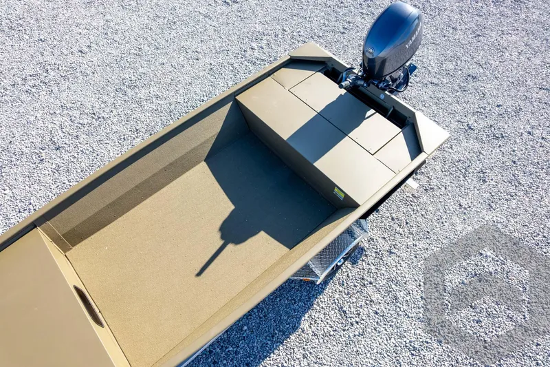 Slide: The Image of 2026 G3 Gator Tough 1652 VBW boat on gravel, featuring a Yamaha outboard motor. - 37