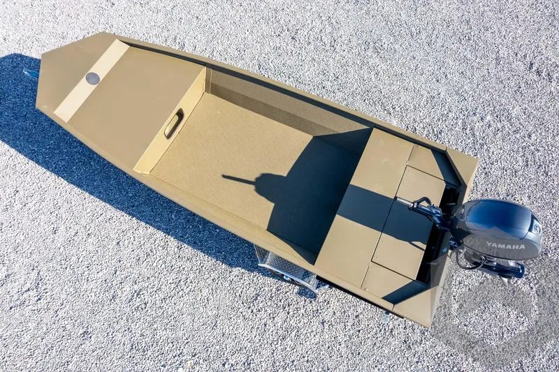 Slide: The Image of 2026 G3 Gator Tough 1652 VBW boat with Yamaha motor on gravel surface. - 40