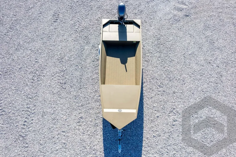Slide: The Image of 2026 G3 Gator Tough 1652 VBW boat, aerial view on gravel surface. - 45
