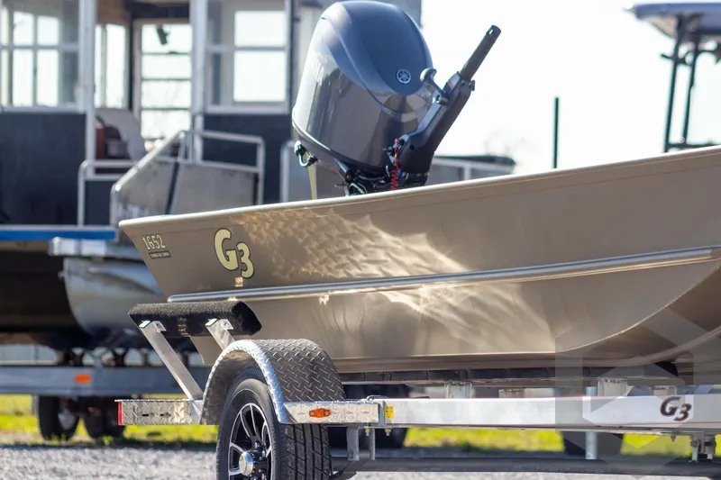 Slide: The Image of 2026 G3 Gator Tough 1652 VBW boat on trailer, outdoor setting. - 5