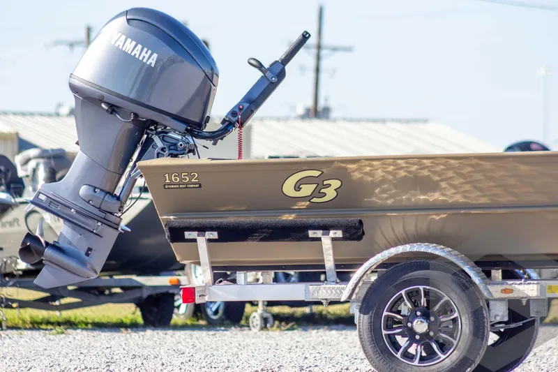 Slide: The Image of 2026 G3 Gator Tough 1652 VBW boat with Yamaha outboard motor on trailer. - 7