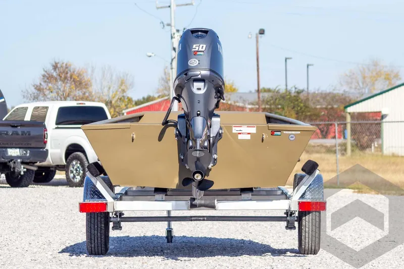 Slide: The Image of 2026 G3 Gator Tough 1652 VBW boat on trailer, rear view with motor. - 9