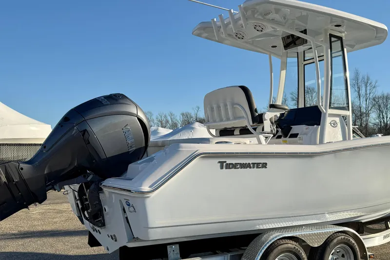 Slide: The Image of 2026 Tidewater 220 LXF boat with Yamaha outboard motor on trailer, clear sky background. - 14