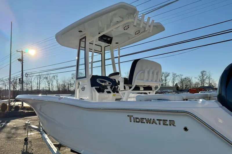 Slide: The Image of 2026 Tidewater 220 LXF boat in sunlight, showcasing sleek design and modern features. - 17