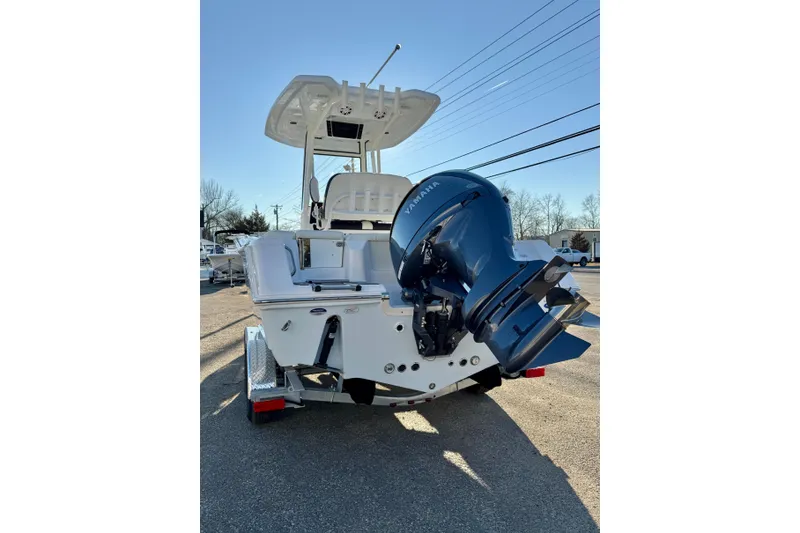 Slide: The Image of 2026 Tidewater 220 LXF boat with Yamaha outboard motor, parked on a trailer. - 25