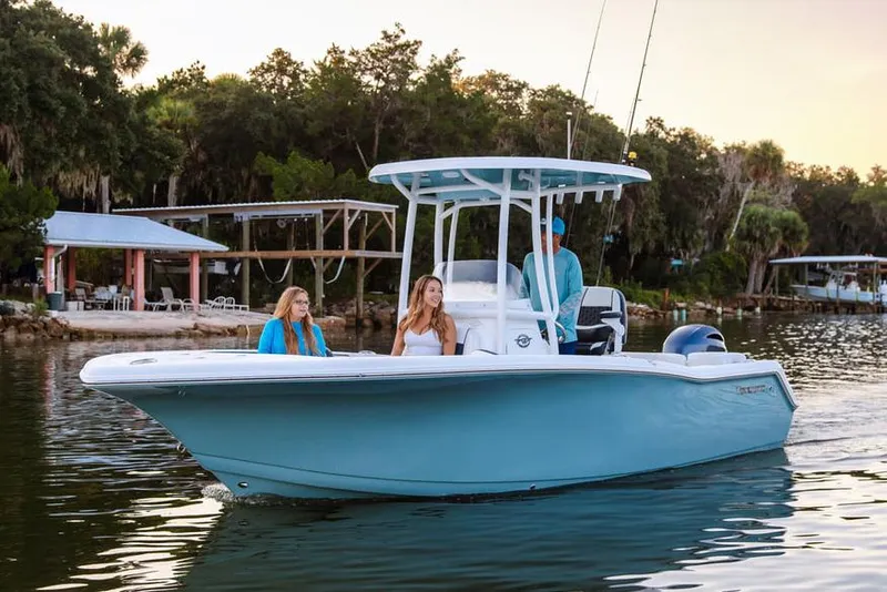 Slide: The Image of 2026 Tidewater 220 LXF boat with sleek design and modern features, parked on a trailer. - 3