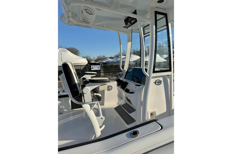 Slide: The Image of 2026 Tidewater 220 LXF boat interior with modern helm and seating. - 6