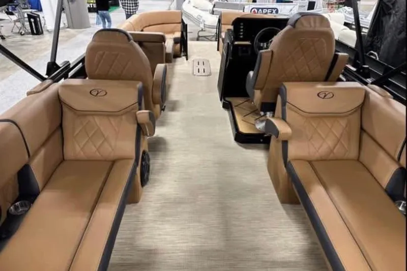Slide: The Image of Luxurious interior of 2024 Veranda Vertex VX25RC pontoon boat with tan leather seating. - 10