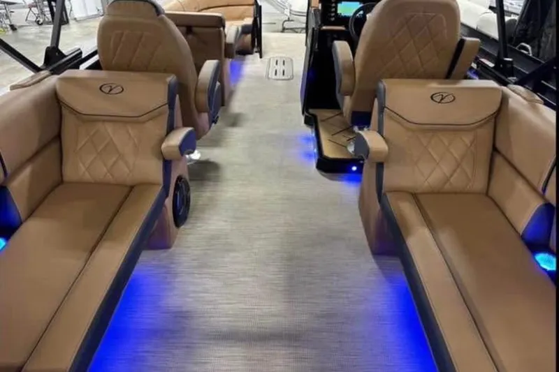 Slide: The Image of Luxurious interior of 2024 Veranda Vertex VX25RC with plush seating and ambient blue lighting. - 11