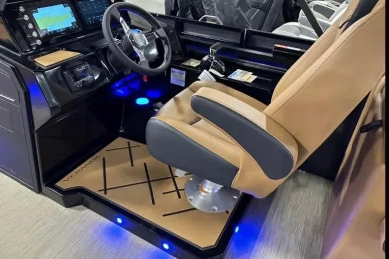 Slide: The Image of 2024 Veranda Vertex VX25RC boat cockpit with modern controls and luxurious seating. - 7