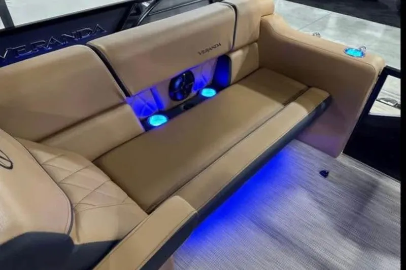 Slide: The Image of Luxurious 2024 Veranda Vertex VX25RC boat seating with ambient blue lighting. - 8