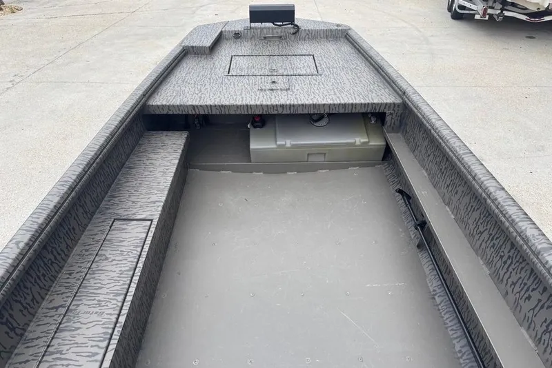 Slide: The Image of 2023 Gator Tail Extreme series boat interior with camouflage pattern and storage compartments. - 12