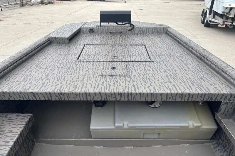 Slide: The Image of 2023 Gator Tail Extreme series boat with camo pattern deck, storage compartment visible. - 14