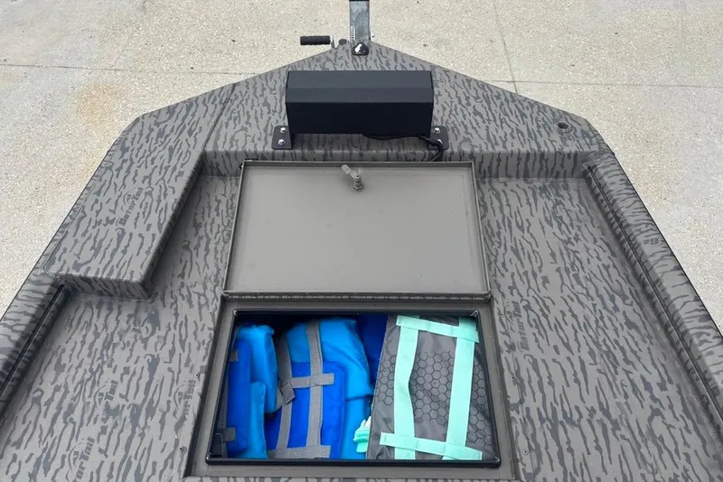 Slide: The Image of 2023 Gator Tail Extreme series boat with open storage compartment, blue life jackets visible. - 15