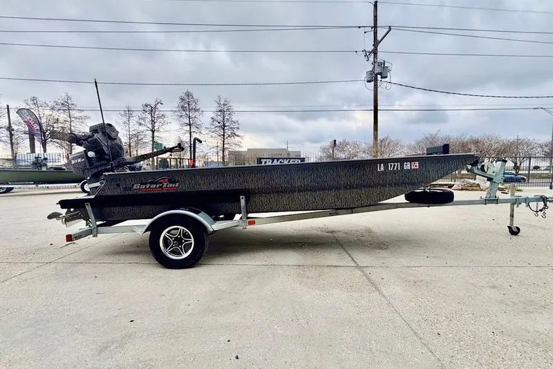 Slide: The Image of 2023 Gator Tail Extreme series boat on trailer, parked outdoors under cloudy sky. - 4