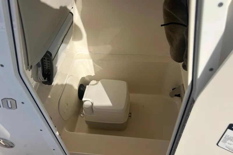 Slide: The Image of 2017 Pathfinder 2600 TRS boat interior with portable toilet. - 14