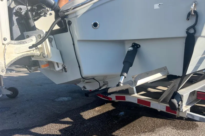 Slide: The Image of 2017 Pathfinder 2600 TRS boat on trailer, showing motor mount and hydraulic components. - 21