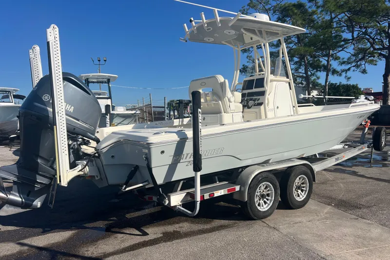 Slide: The Image of 2017 Pathfinder 2600 TRS boat on trailer with Yamaha outboard motor, parked outdoors. - 3