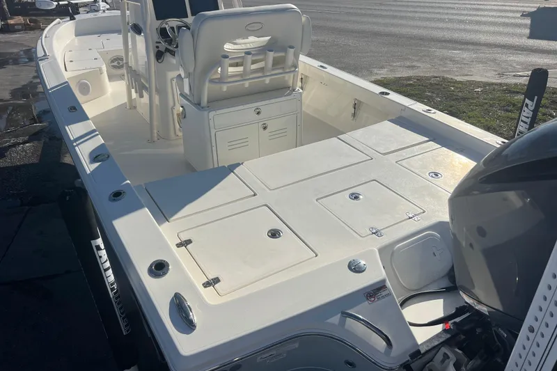 Slide: The Image of 2017 Pathfinder 2600 TRS boat interior with seating and storage compartments. - 5