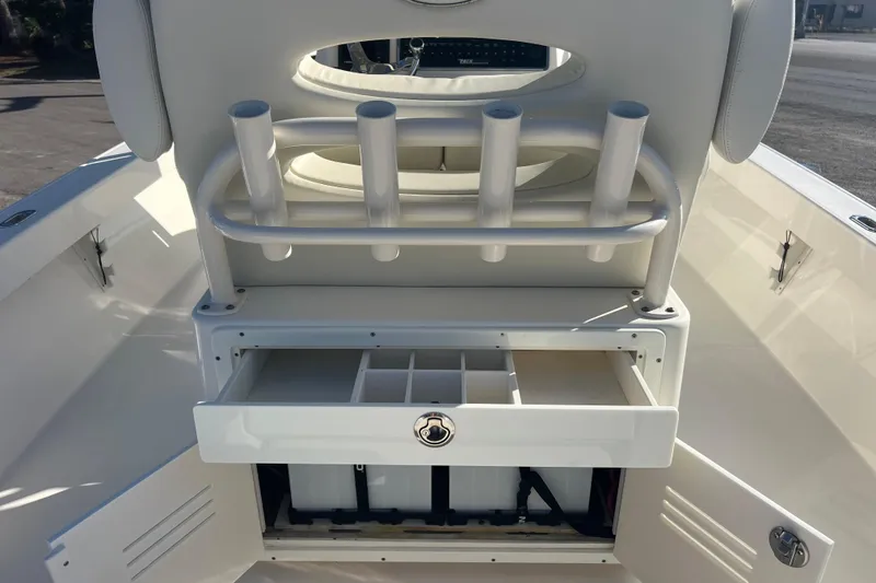 Slide: The Image of 2017 Pathfinder 2600 TRS boat with rod holders and storage compartments. - 7