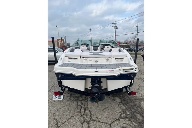 Slide: The Image of 2020 Chaparral 21 SSi Ski & Fish boat, rear view in parking lot. - 2