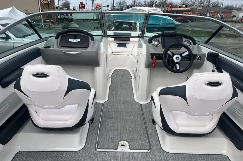 Slide: The Image of 2020 Chaparral 21 SSi Ski & Fish boat interior with dual seats and steering console. - 7